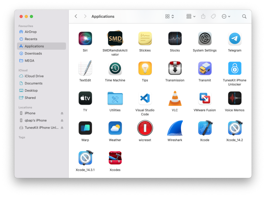 Applications folder on macOS with TunesKit iPhone Unlocker installed.
